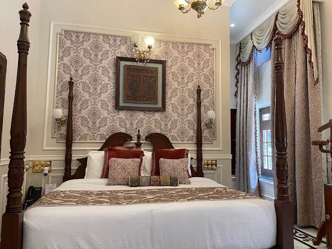 Royal room with decorative headboard and heritage styling